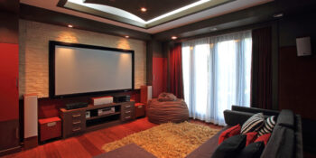 Theater room in luxury home with wide screen Theater room in luxury home with wide screen